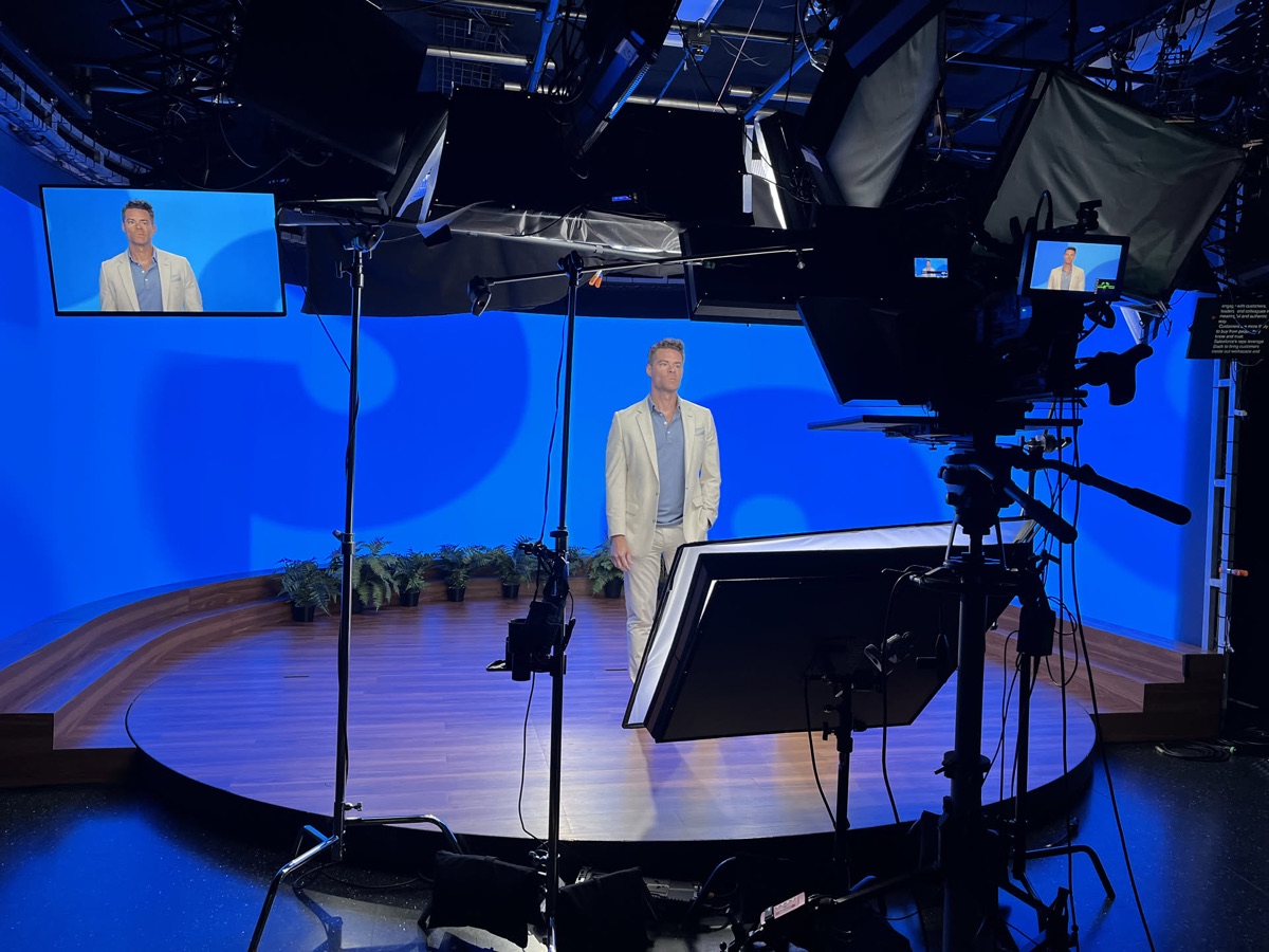 Daniel Martin on the Salesforce+ studio set, with cameras and monitors in the foreground